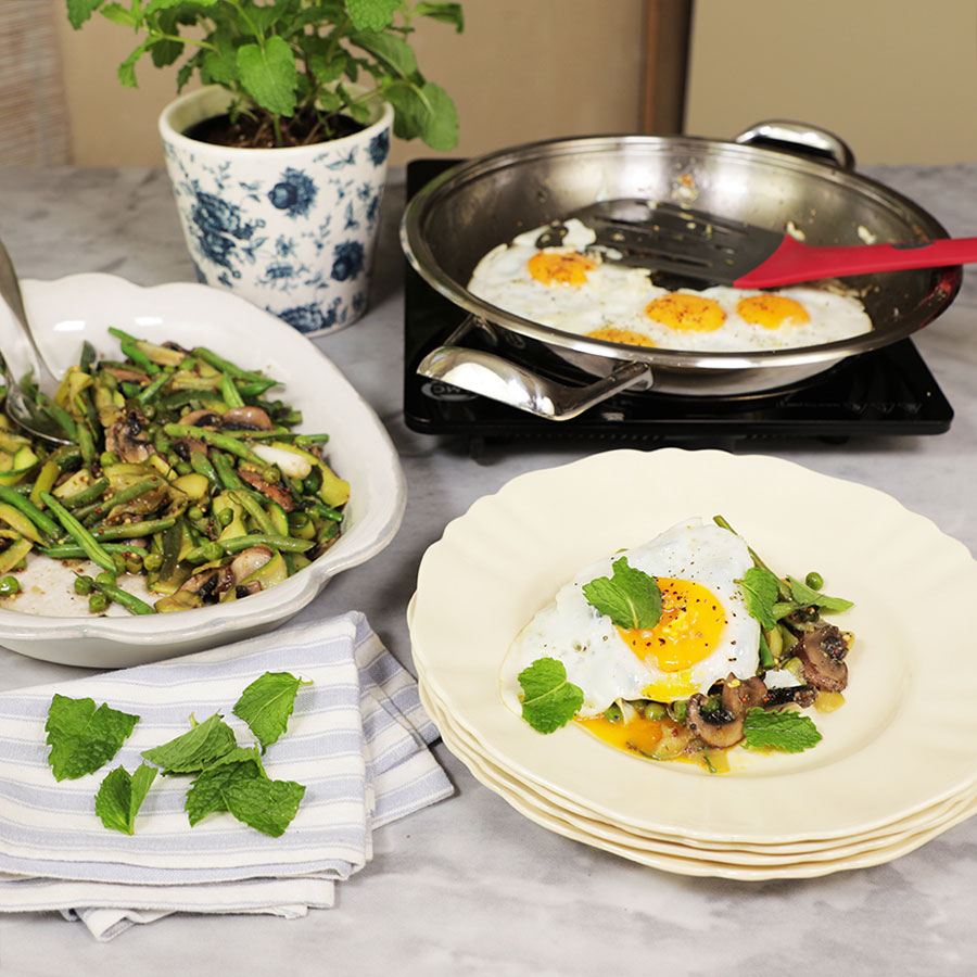Green veg and eggs cooked in one pan